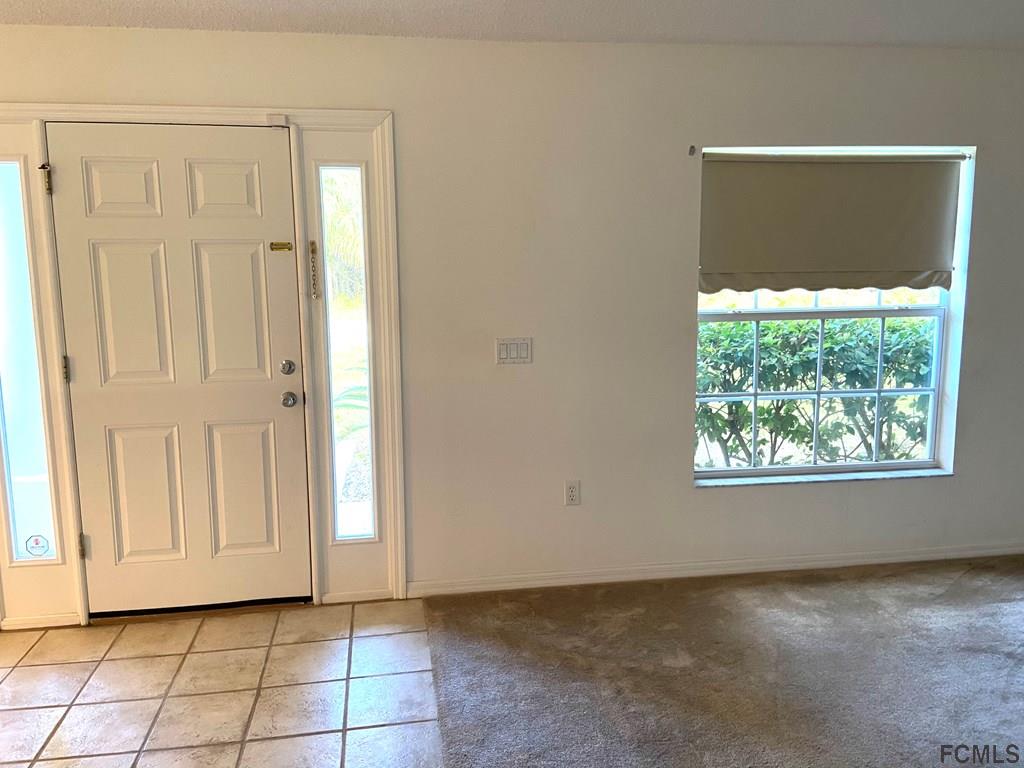 62 Rae Drive Palm Coast, FL 32164 - Photo 6 of 24 Front Door entrance view