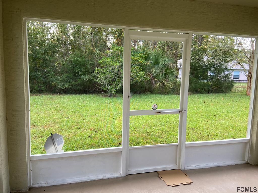 62 Rae Drive Palm Coast, FL 32164 - Photo 9 of 24 Patio view to back yard