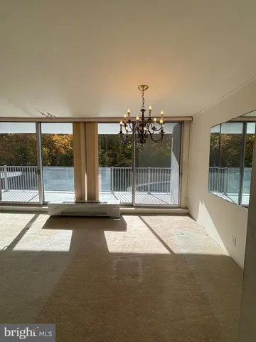 a view of an empty room with a balcony