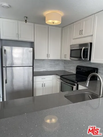 a kitchen with a sink and a window