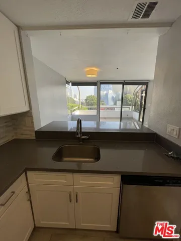 a view of a kitchen cabinets and wooden floor