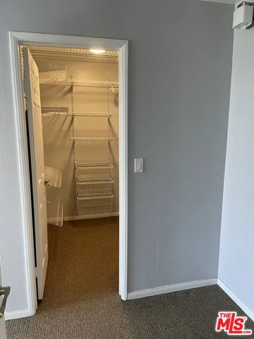 a view of a room with racks on the wall