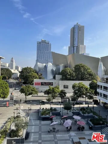 a front view of house with yard and trees around
