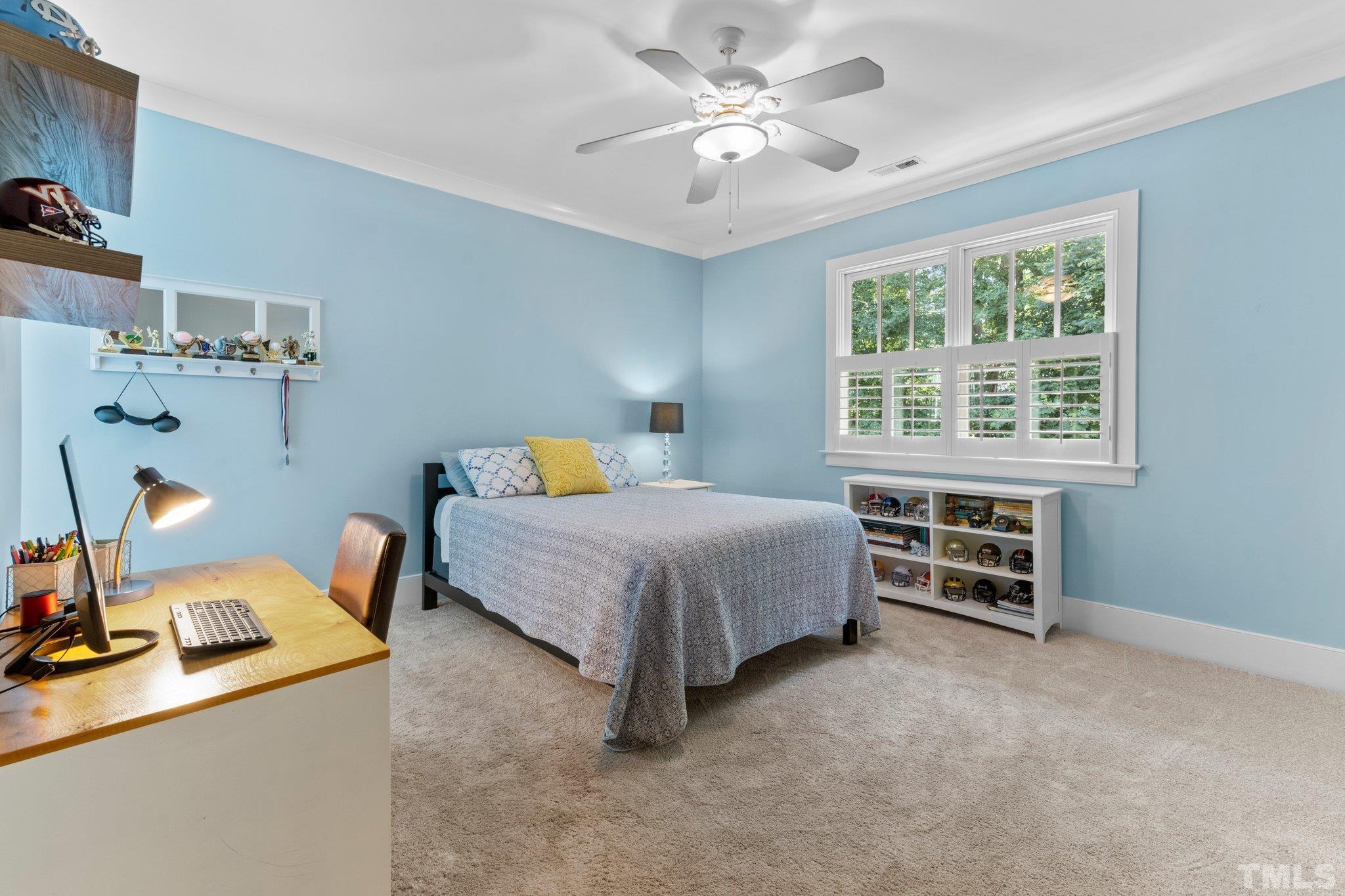 5213 Atherton Bridge Road Raleigh, NC 27613 - Photo 54 of 58 a bedroom with a bed and a window