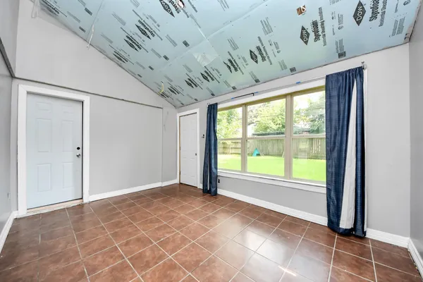 a view of an empty room with a window