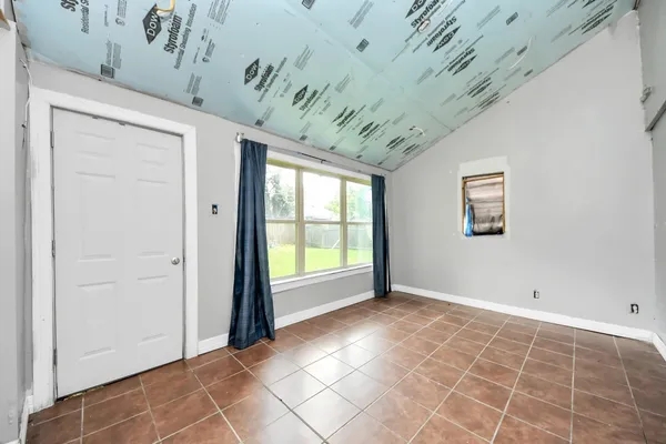 a view of an empty room with a window
