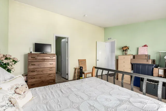 a bedroom with a bed and furniture