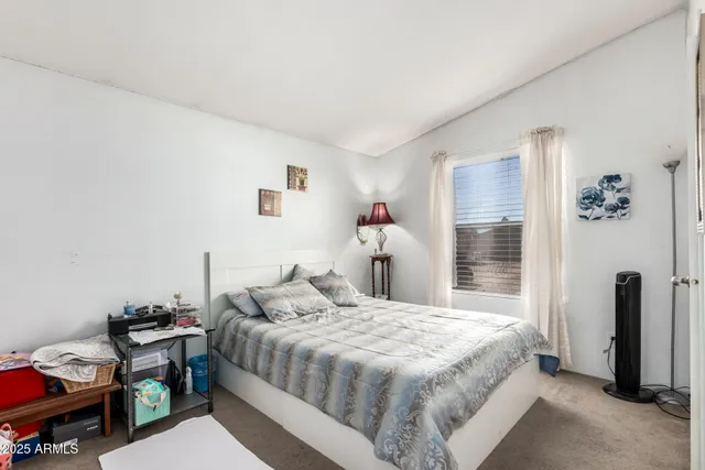 a bedroom with a bed and a closet