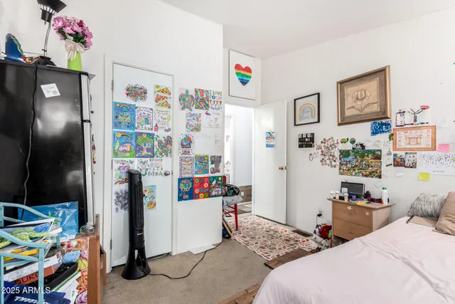 a bedroom with a bed and closet