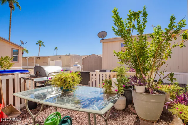 a view of a chairs and table in the patio