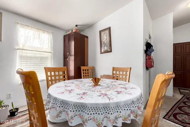 a dining room with furniture and window