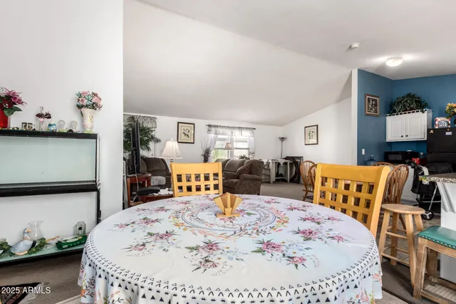 a large bedroom with a bed and wooden floor
