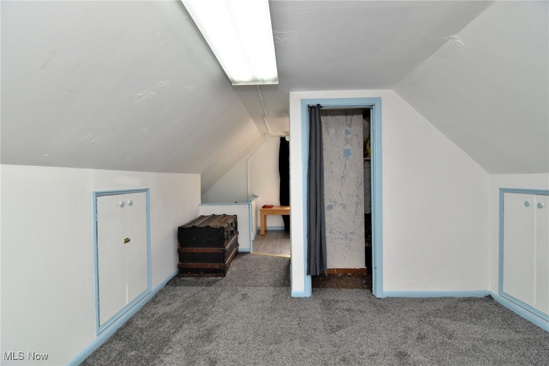 4213 Valley Road Cleveland, OH 44109 - Photo 35 of 47 Additional living space with carpet flooring and vaulted ceiling