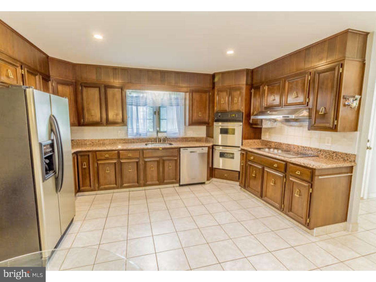 725 Burnley Road Wilmington, DE 19803 - Photo 11 of 23 a large kitchen with stainless steel appliances granite countertop a stove a sink dishwasher and a refrigerator