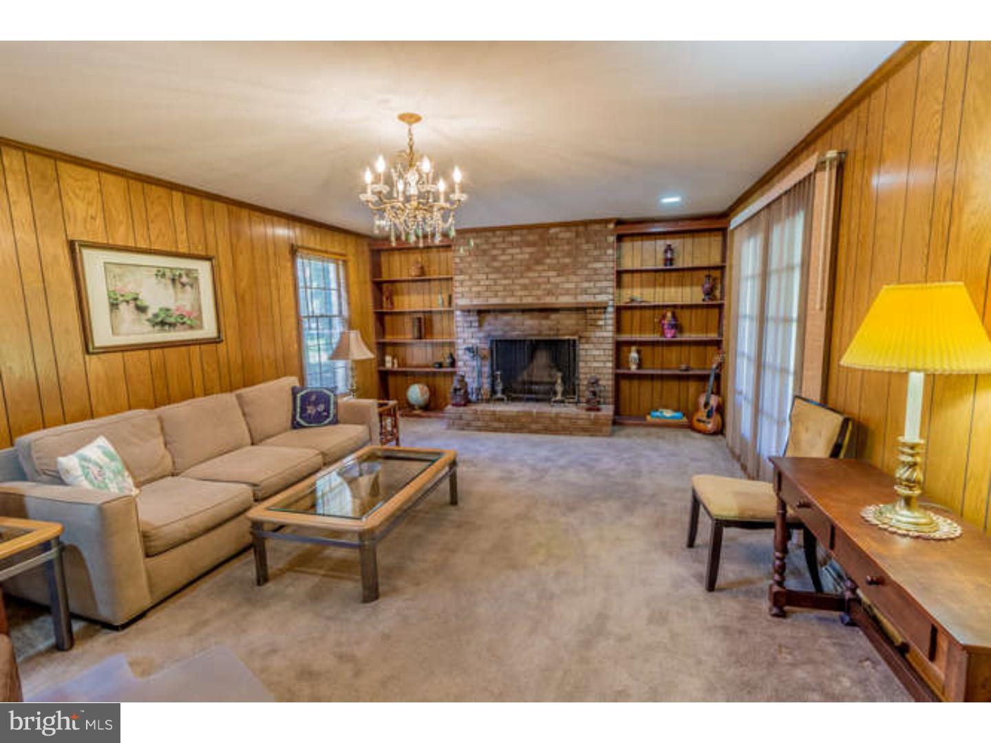 725 Burnley Road Wilmington, DE 19803 - Photo 14 of 23 a living room with furniture and a fireplace