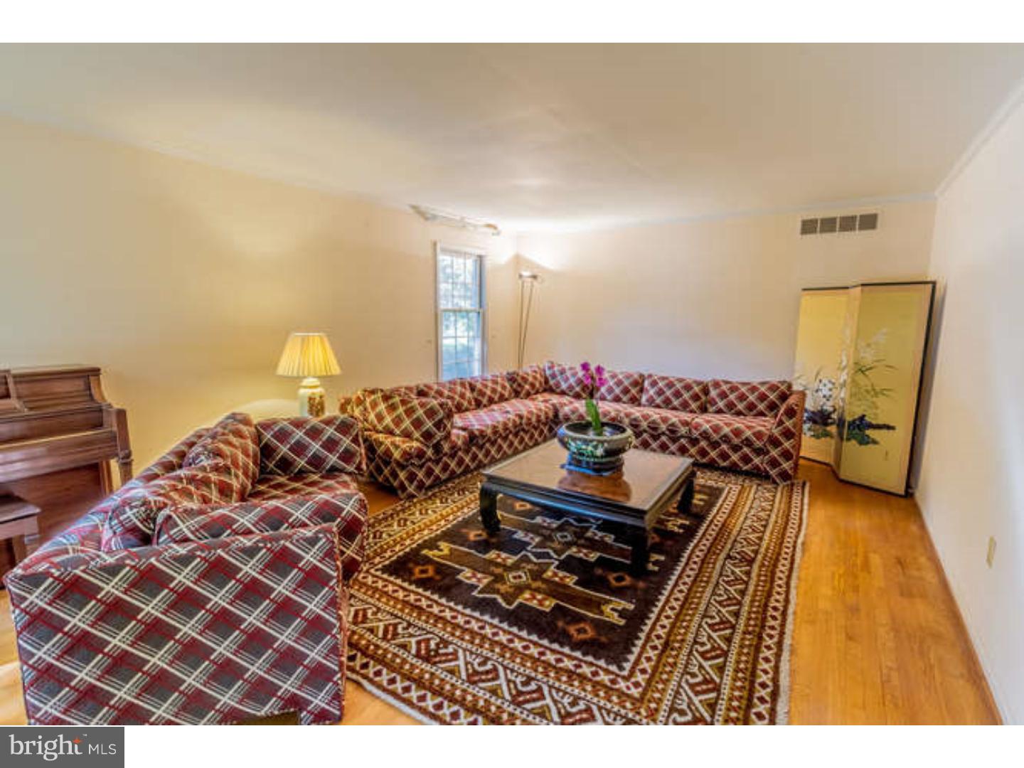 725 Burnley Road Wilmington, DE 19803 - Photo 6 of 23 a bedroom with bed and a couch