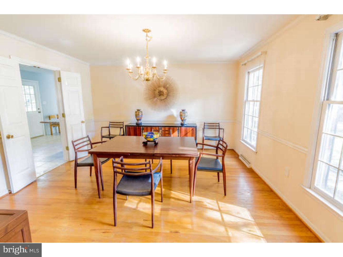 725 Burnley Road Wilmington, DE 19803 - Photo 8 of 23 a view of a dining room with furniture and chandelier