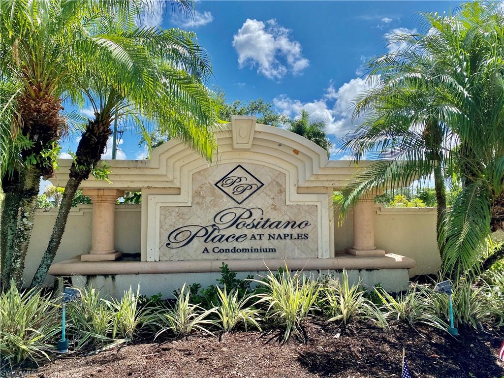 a sign that is on a brick wall