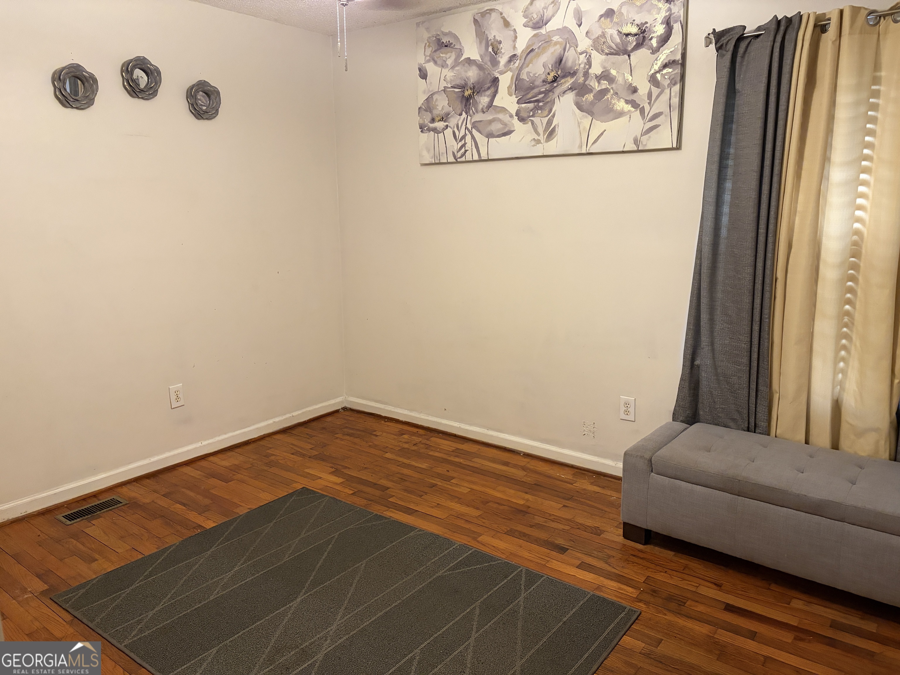 1216 North Bellview Road Aragon, GA 30104 - Photo 12 of 19 a view of a bedroom with wooden floor and a window