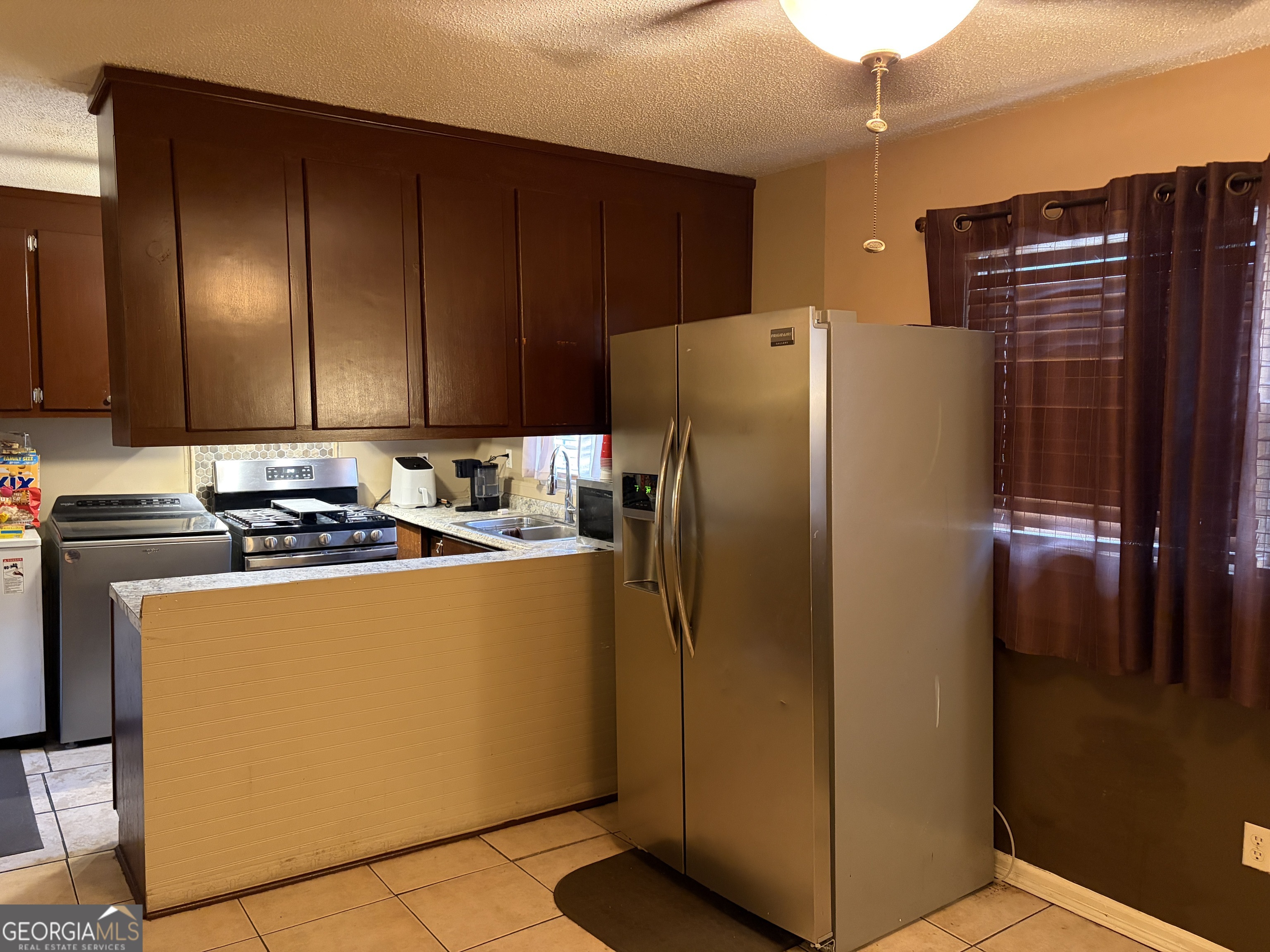 1216 North Bellview Road Aragon, GA 30104 - Photo 6 of 19 a kitchen with metallic refrigerator freezer and a dishwasher
