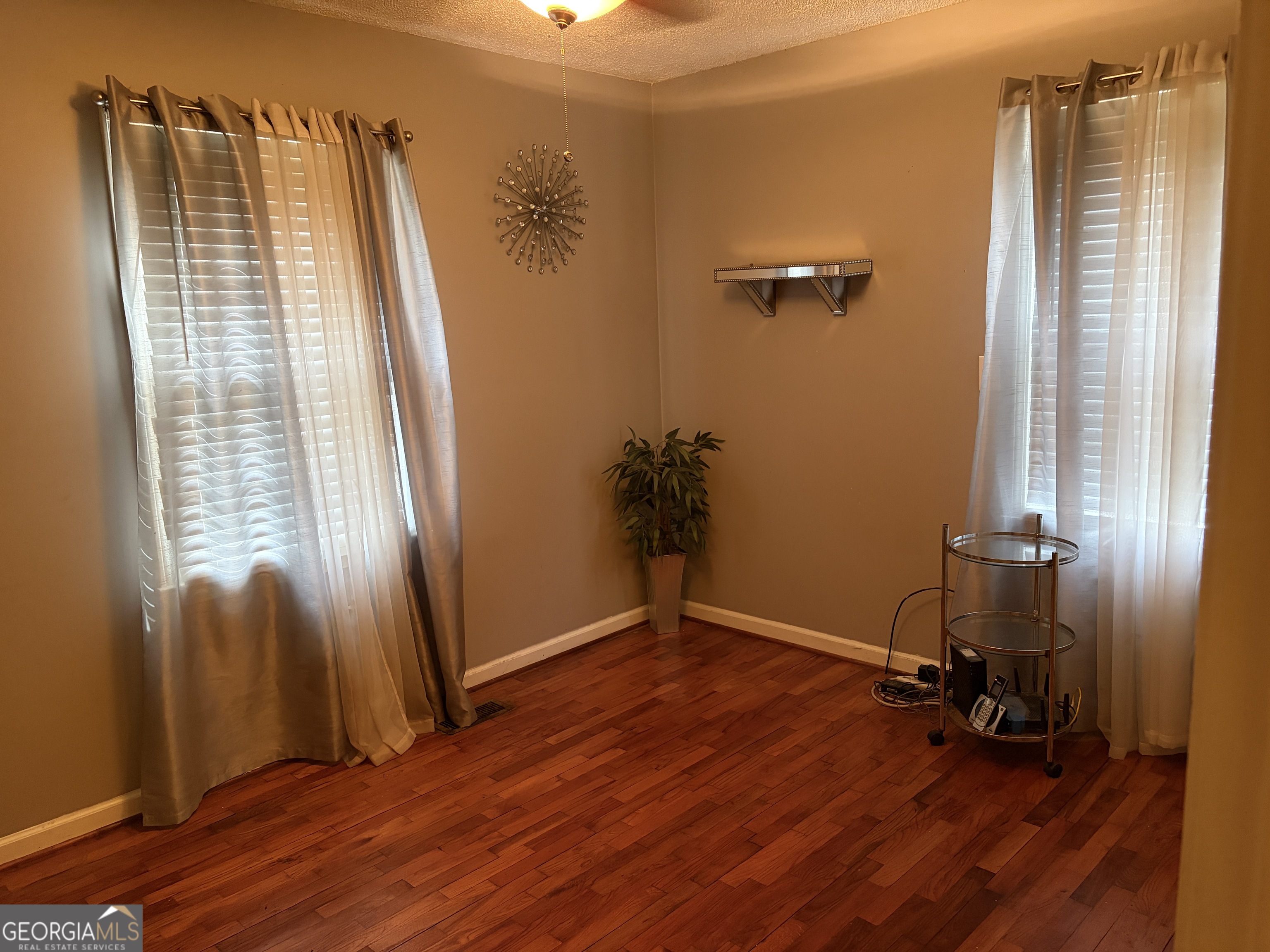 1216 North Bellview Road Aragon, GA 30104 - Photo 9 of 19 wooden floor and windows in a room