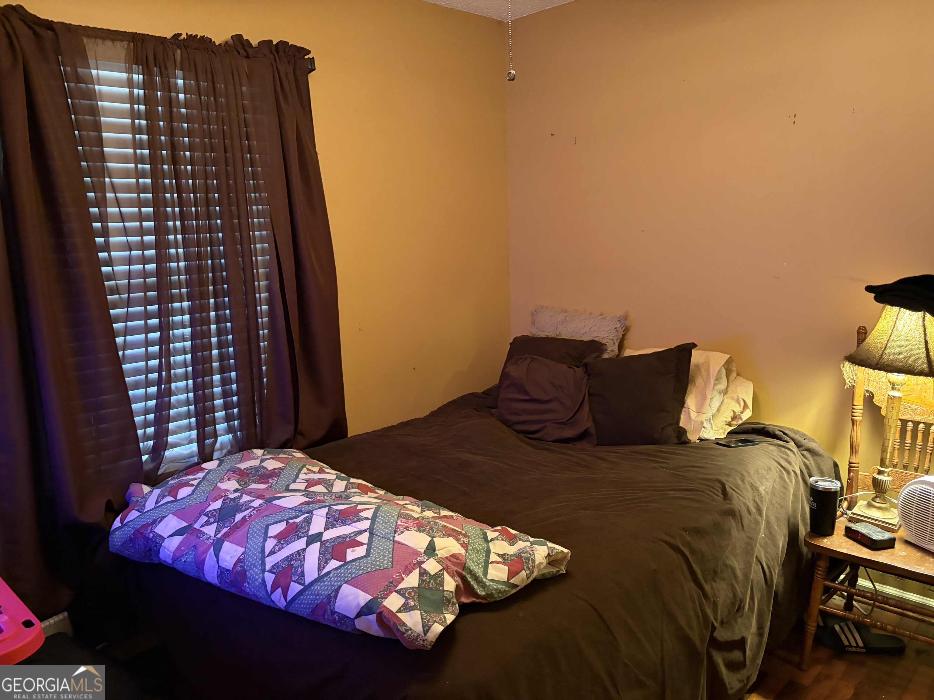 1216 North Bellview Road Aragon, GA 30104 - Photo 10 of 19 a bedroom with a bed and a night stand