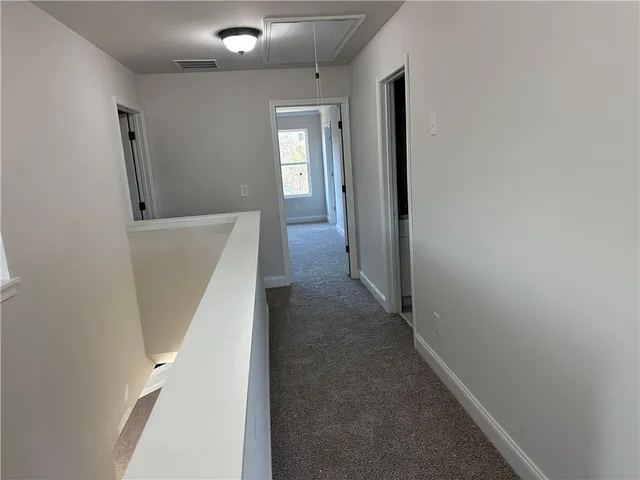 a view of hallway with stairs