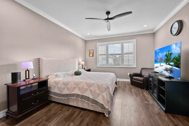 a bathroom with a granite countertop sink a mirror and a bathtub