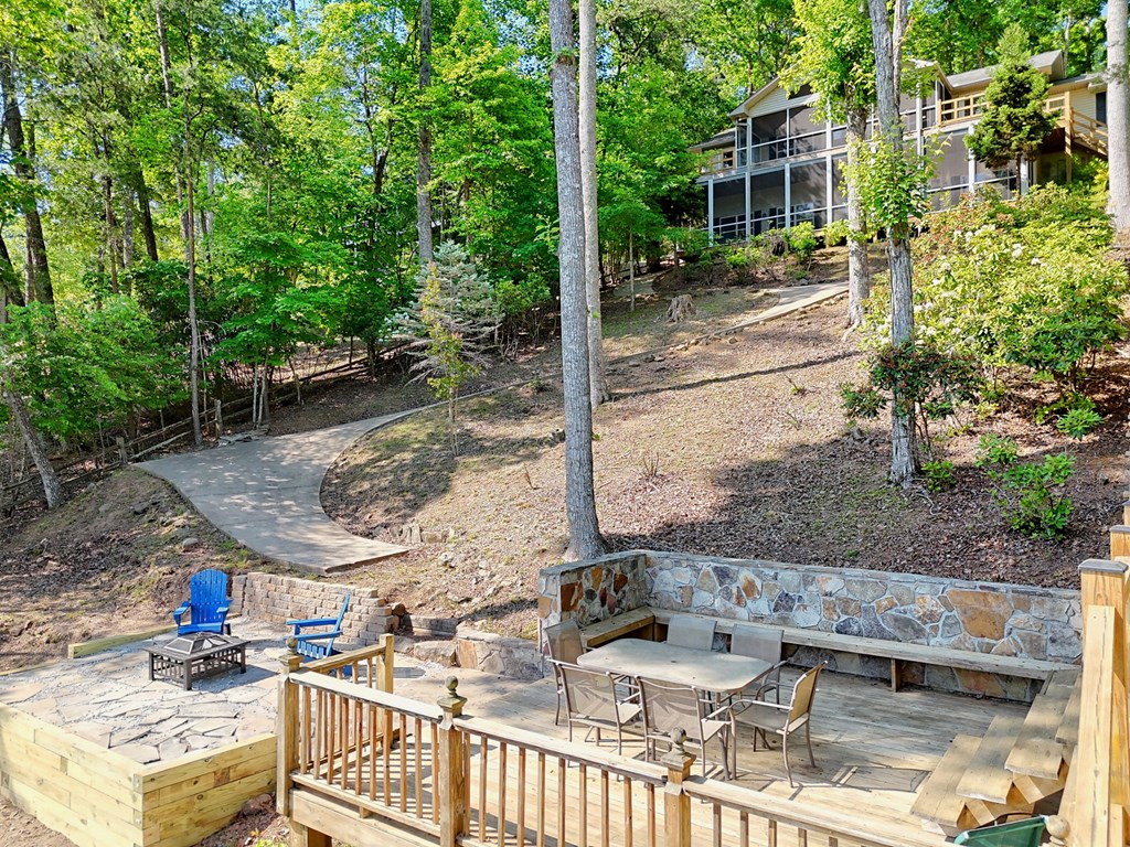456 Deaver Cove Road Blairsville, GA 30512 - Photo 73 of 83 a view of a patio with table and chairs and potted plants