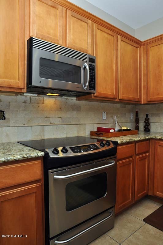 20798 West Ridge Road Buckeye, AZ 85396 - Photo 12 of 47 a kitchen with a stove microwave and sink