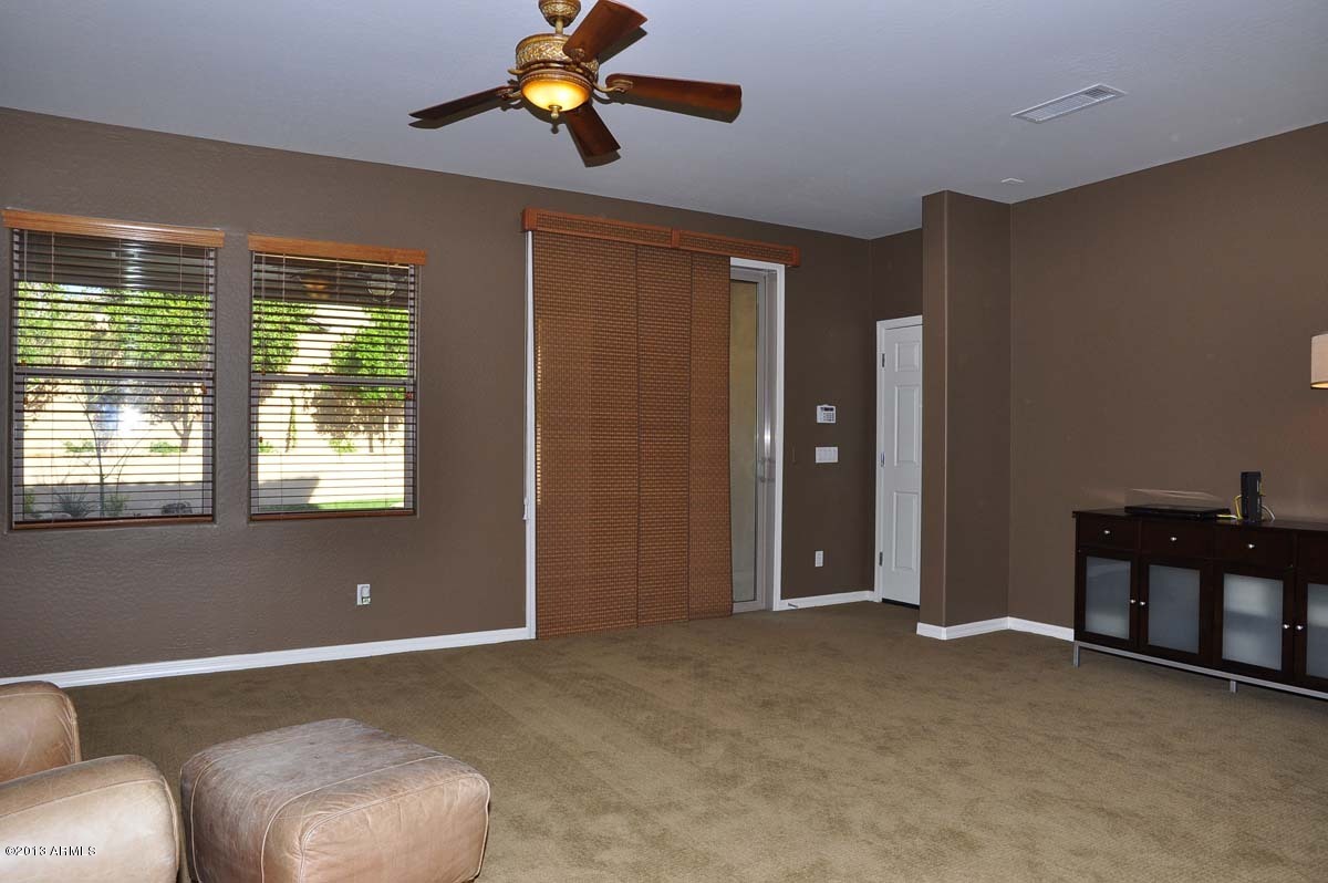 20798 West Ridge Road Buckeye, AZ 85396 - Photo 18 of 47 a view of livingroom with furniture and chandelier fan
