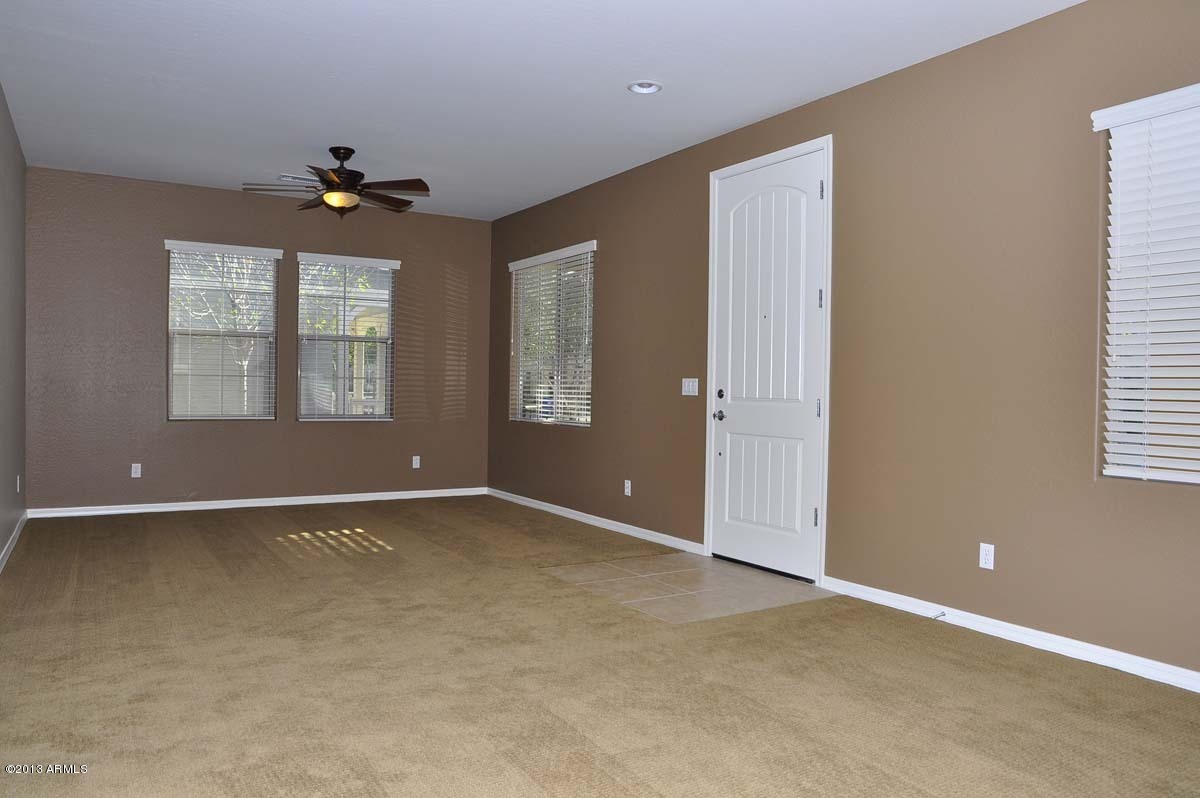 20798 West Ridge Road Buckeye, AZ 85396 - Photo 20 of 47 an empty room with windows and closet