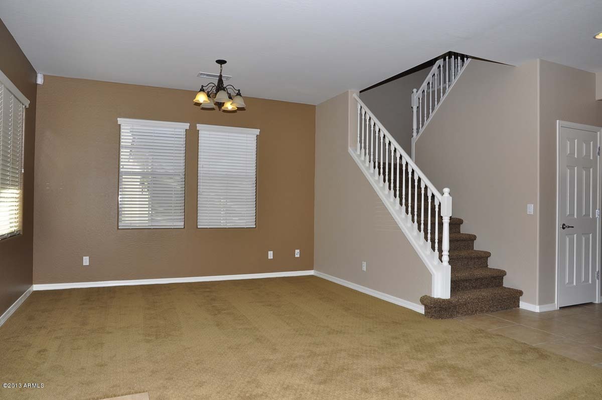 20798 West Ridge Road Buckeye, AZ 85396 - Photo 21 of 47 wooden floor in an empty room with a window