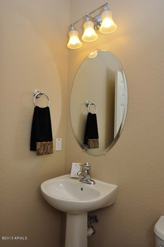 20798 West Ridge Road Buckeye, AZ 85396 - Photo 23 of 47 a bathroom with a sink and mirror