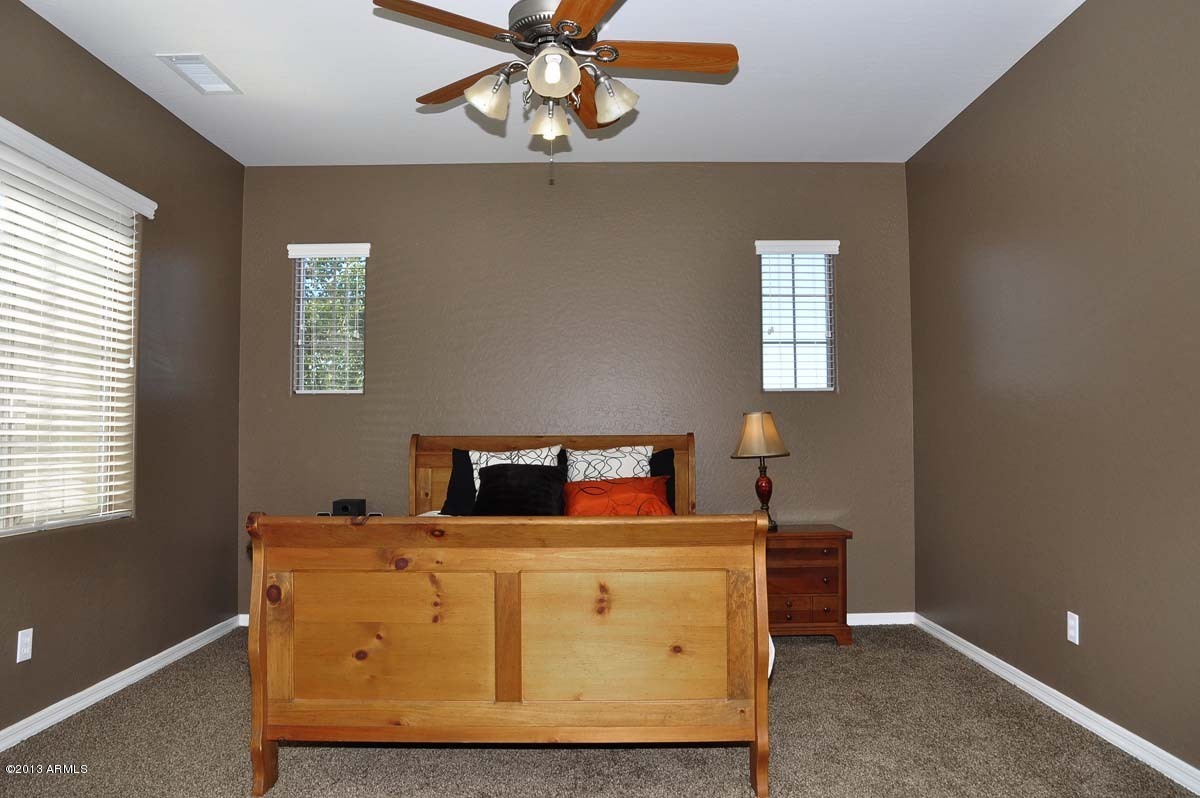 20798 West Ridge Road Buckeye, AZ 85396 - Photo 27 of 47 a room with bed and window