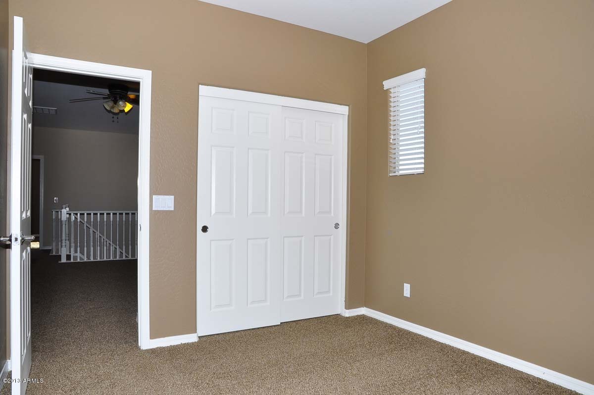 20798 West Ridge Road Buckeye, AZ 85396 - Photo 39 of 47 an empty room with a hallway