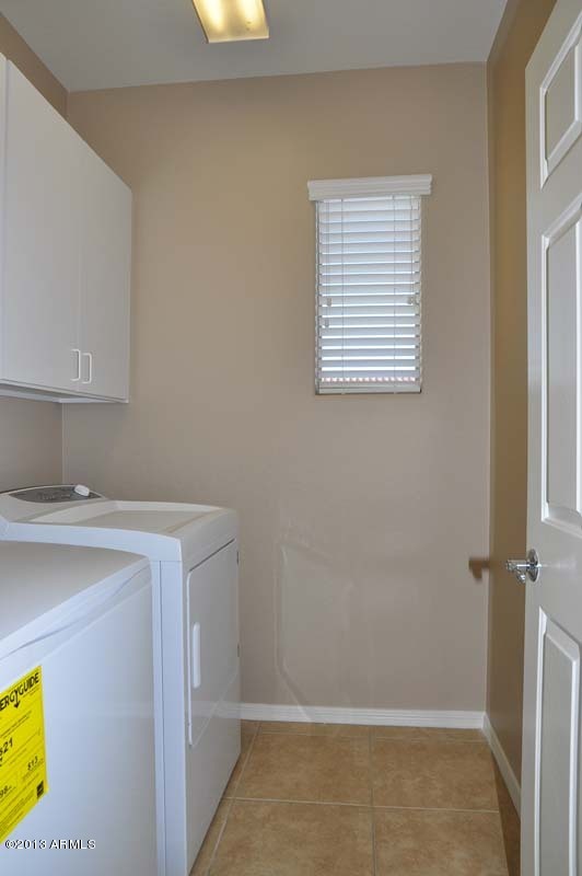 20798 West Ridge Road Buckeye, AZ 85396 - Photo 45 of 47 a bathroom with a sink a window and a shower
