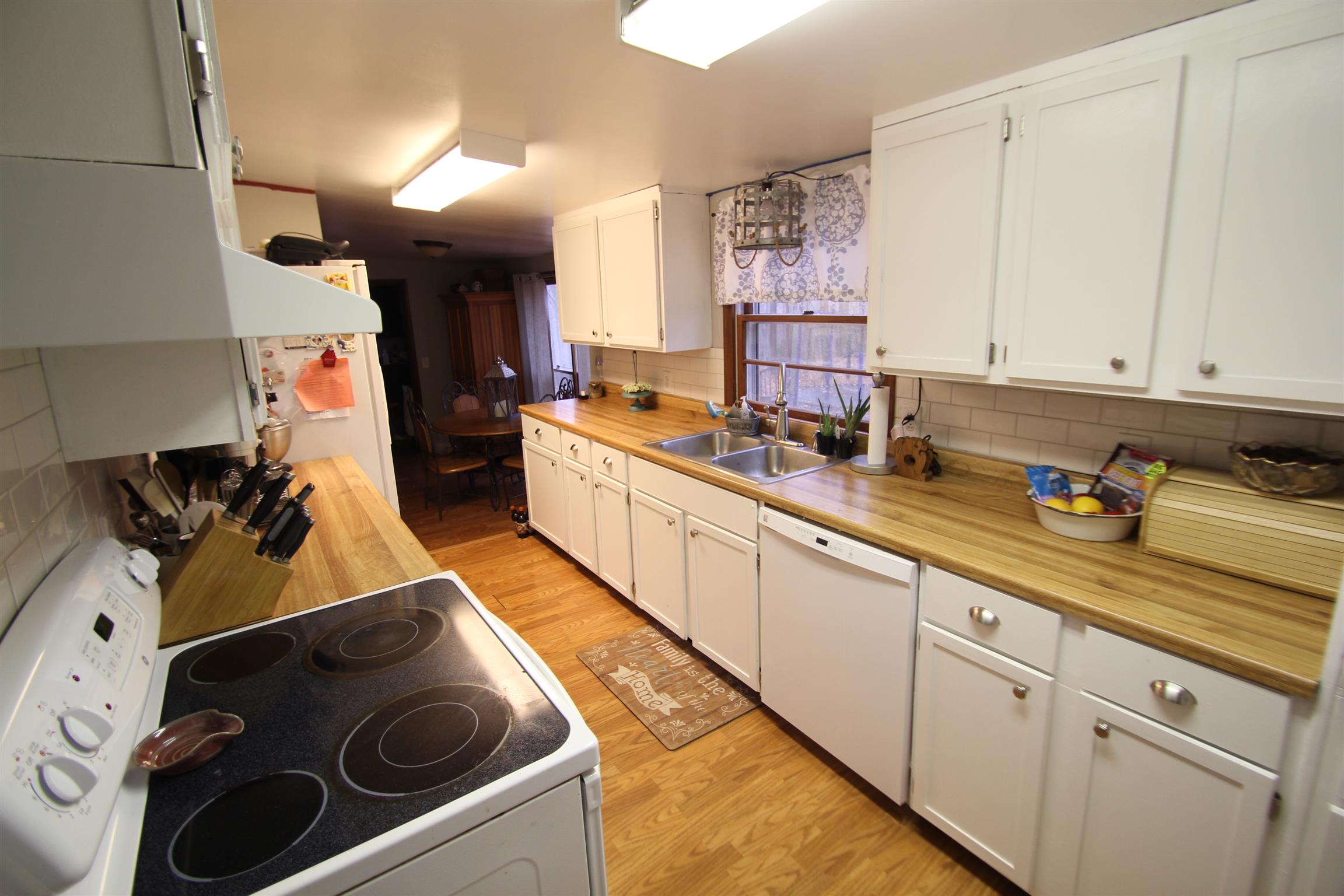 1090 Lambert Ridge Road Wartrace, TN 37183 - Photo 4 of 11 a kitchen with stainless steel appliances granite countertop a sink stove and cabinets