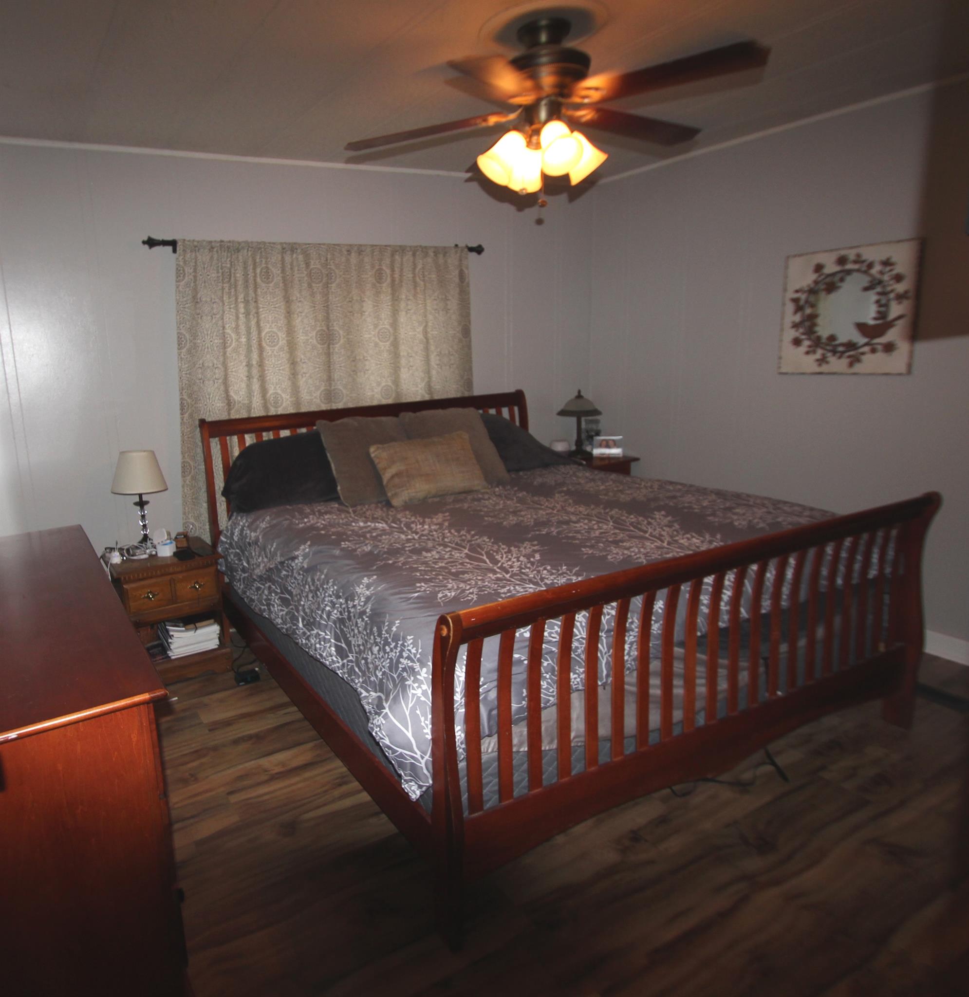 1090 Lambert Ridge Road Wartrace, TN 37183 - Photo 5 of 11 a bedroom with a bed and a chandelier