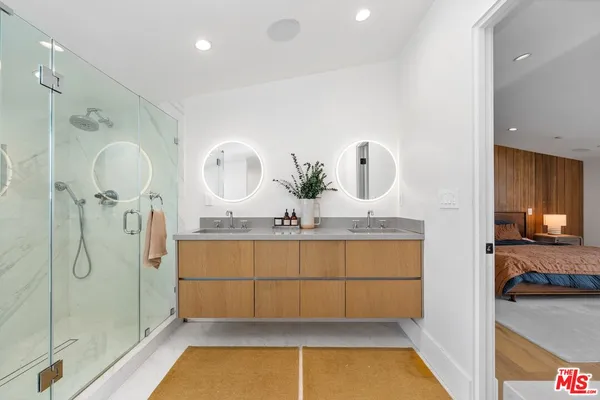 a bathroom with a tub sink and mirror