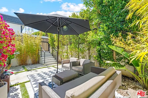 a view of an outdoor sitting area with furniture
