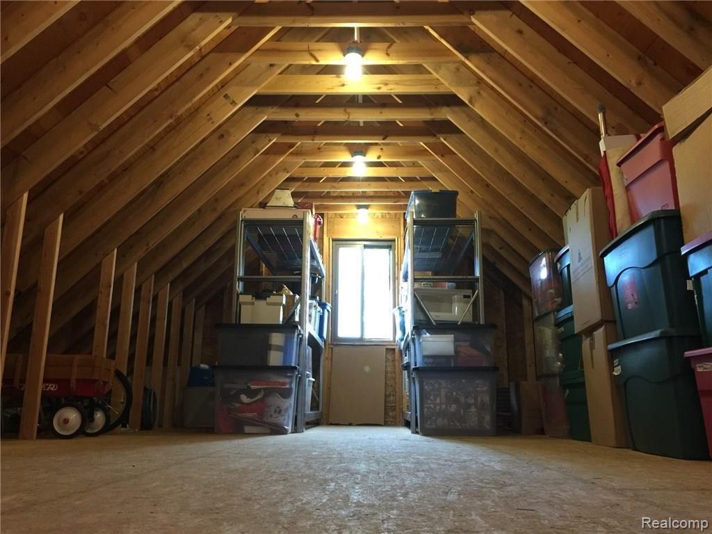 Heated workshop/storage room/hobby room in upper level of garage