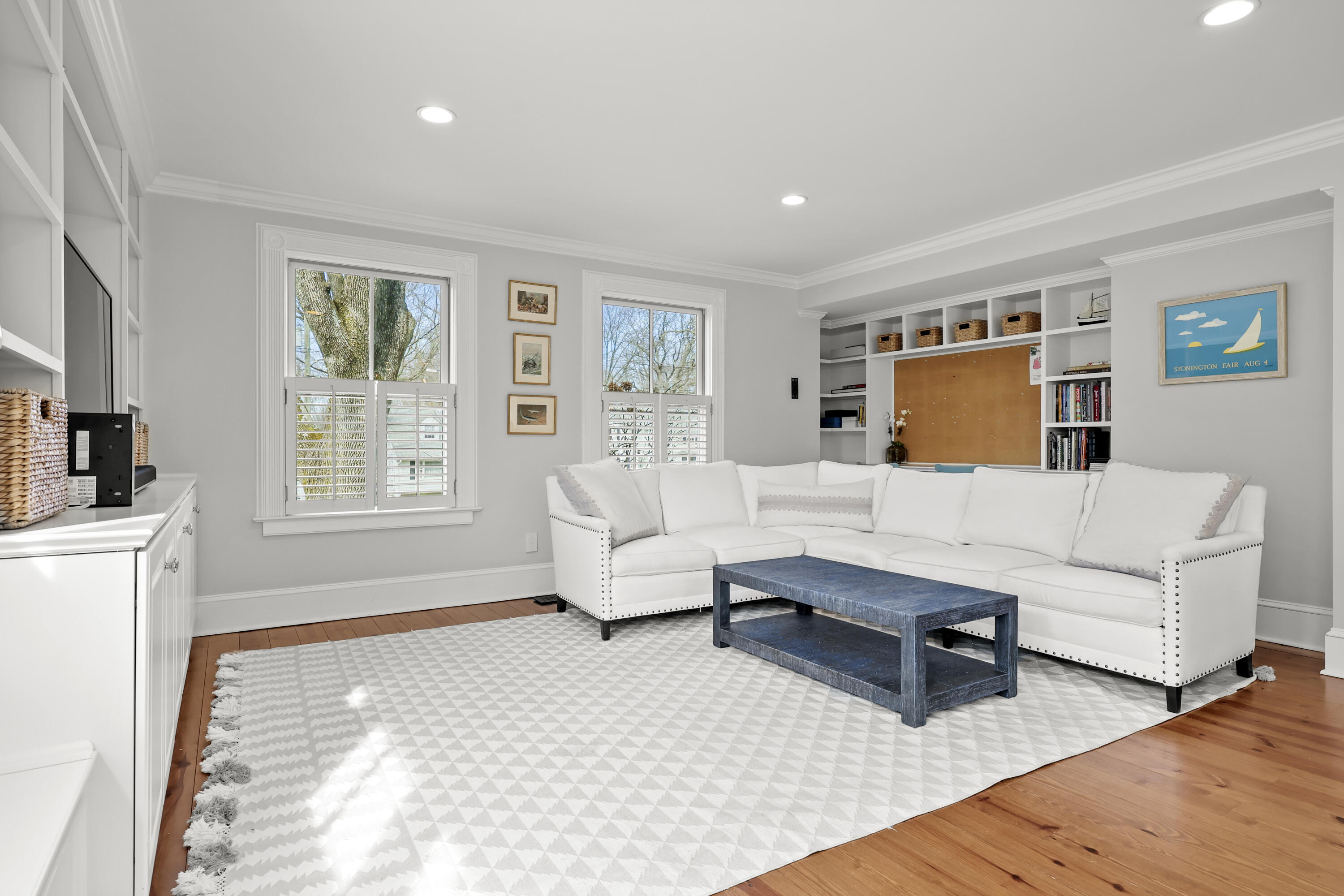 100 Hollow Tree Ridge Road Darien, CT 06820 - Photo 14 of 38 a living room with furniture flat screen tv and large window