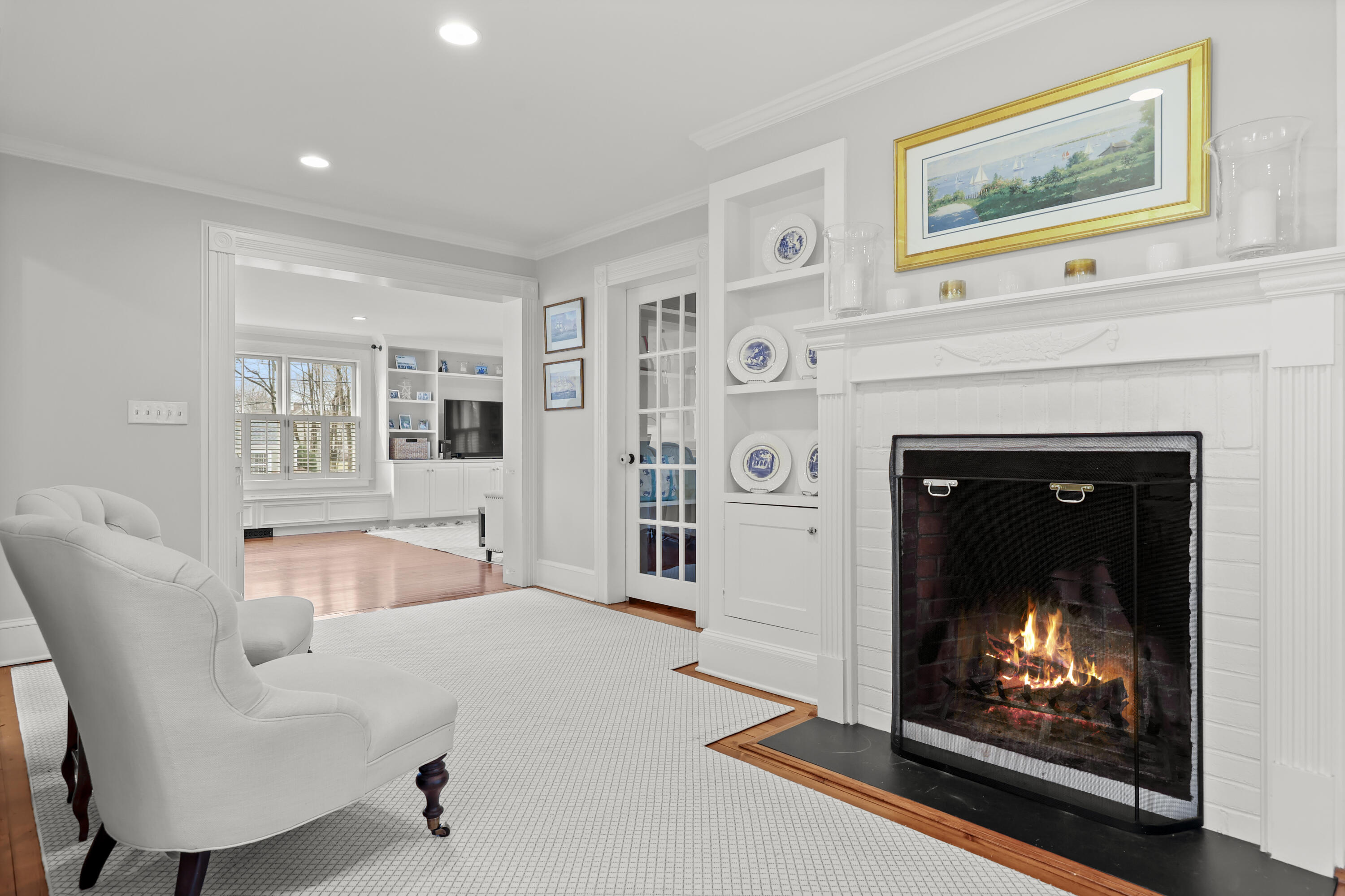 100 Hollow Tree Ridge Road Darien, CT 06820 - Photo 17 of 38 a living room with furniture and a fireplace