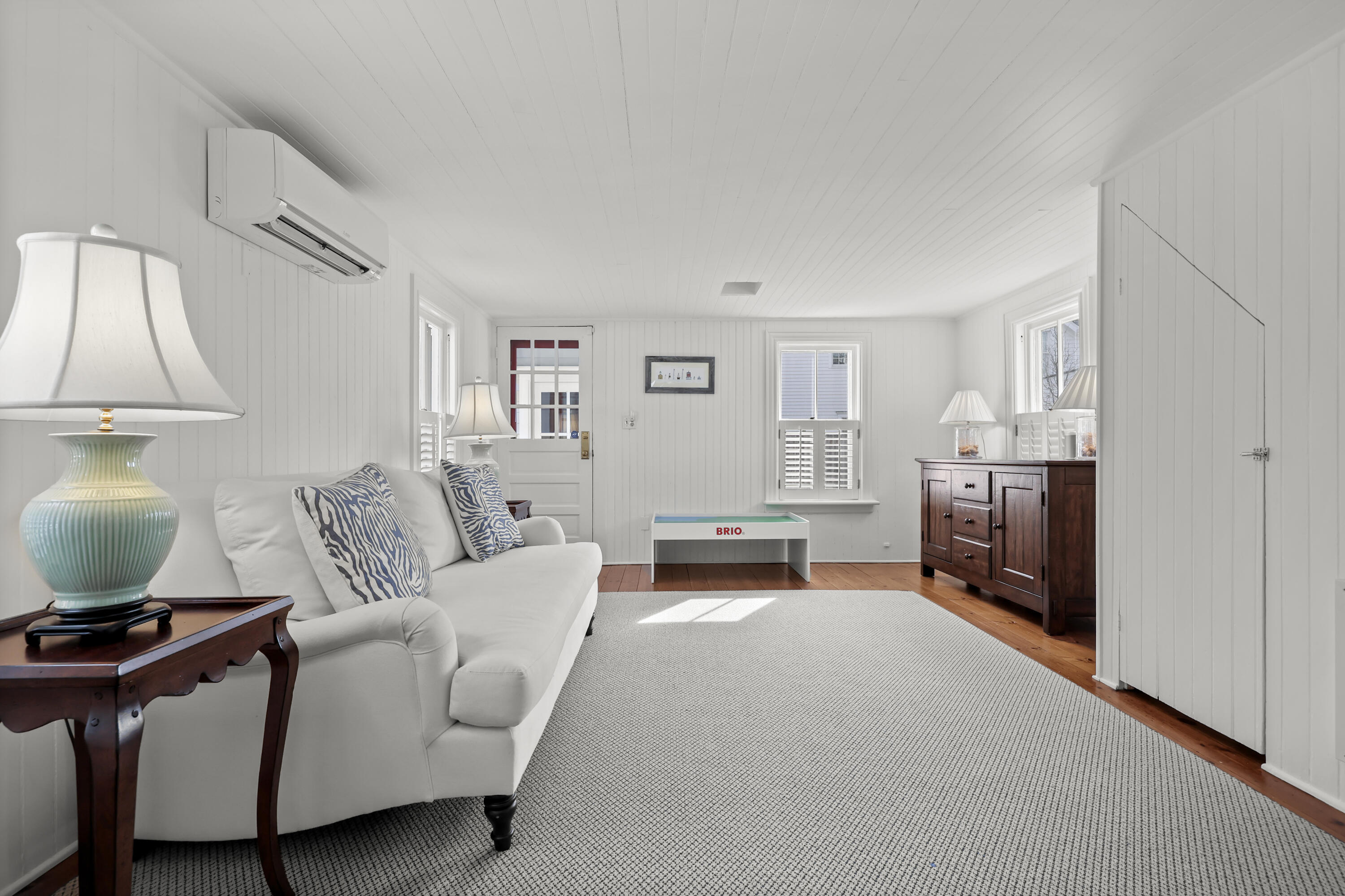 100 Hollow Tree Ridge Road Darien, CT 06820 - Photo 18 of 38 a living room with furniture and a lamp