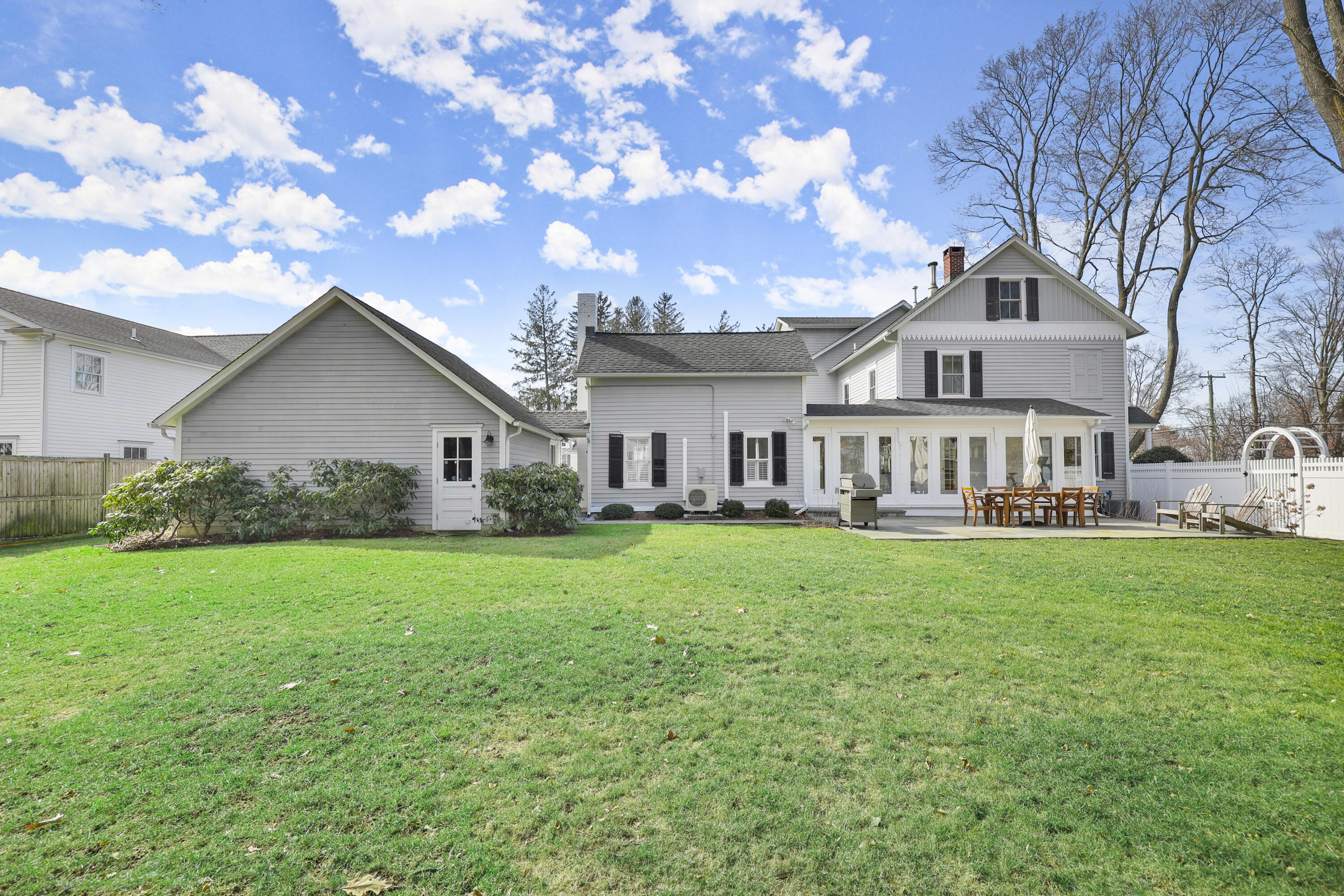 100 Hollow Tree Ridge Road Darien, CT 06820 - Photo 2 of 38 a front view of a house with garden