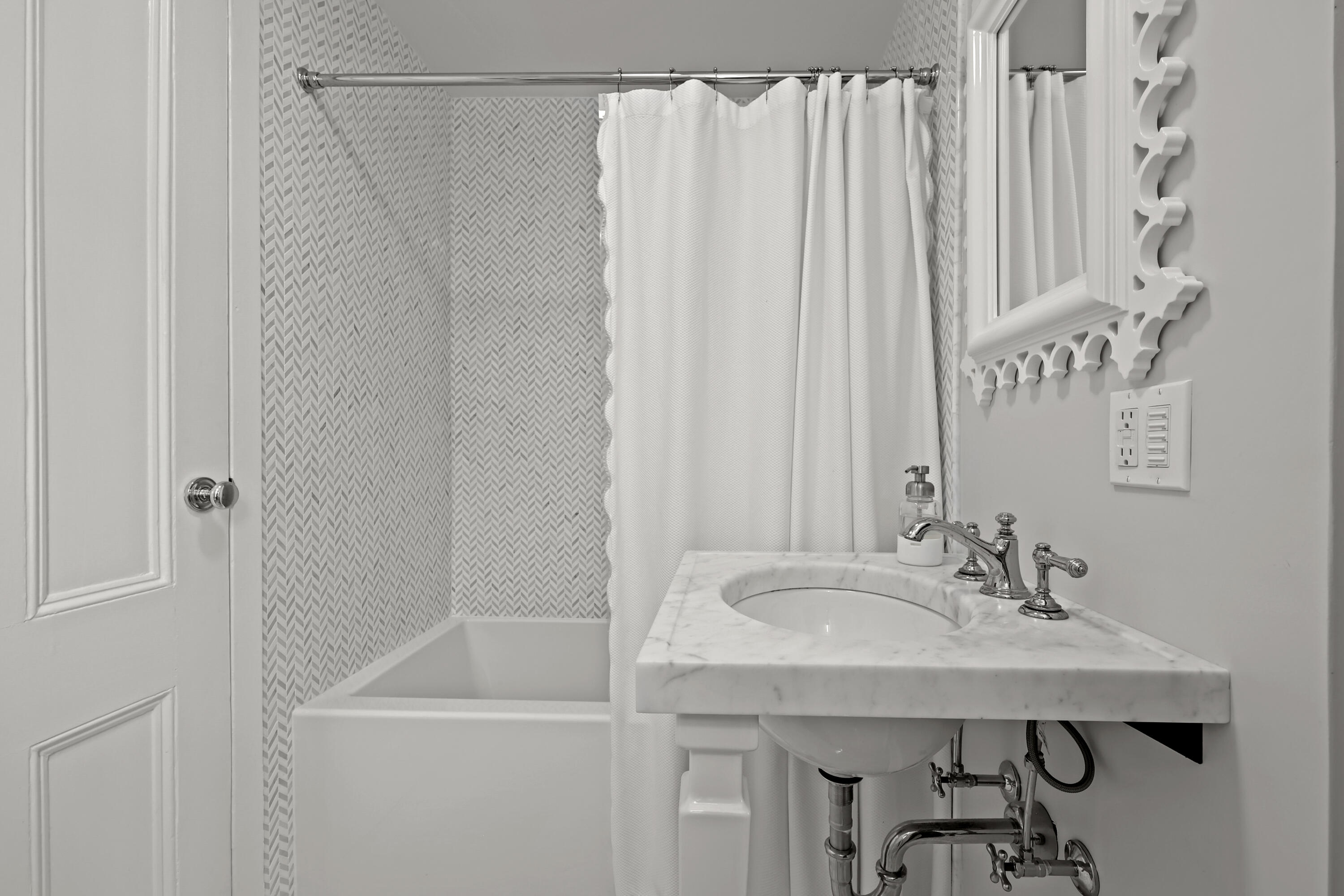 100 Hollow Tree Ridge Road Darien, CT 06820 - Photo 22 of 38 a bathroom with a sink a mirror and a shower