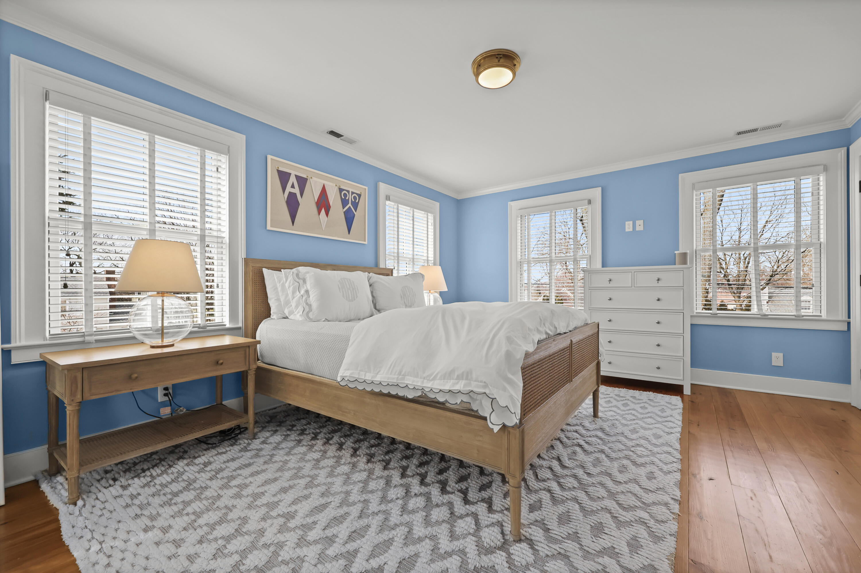 100 Hollow Tree Ridge Road Darien, CT 06820 - Photo 24 of 38 a bedroom with a bed and wooden floor