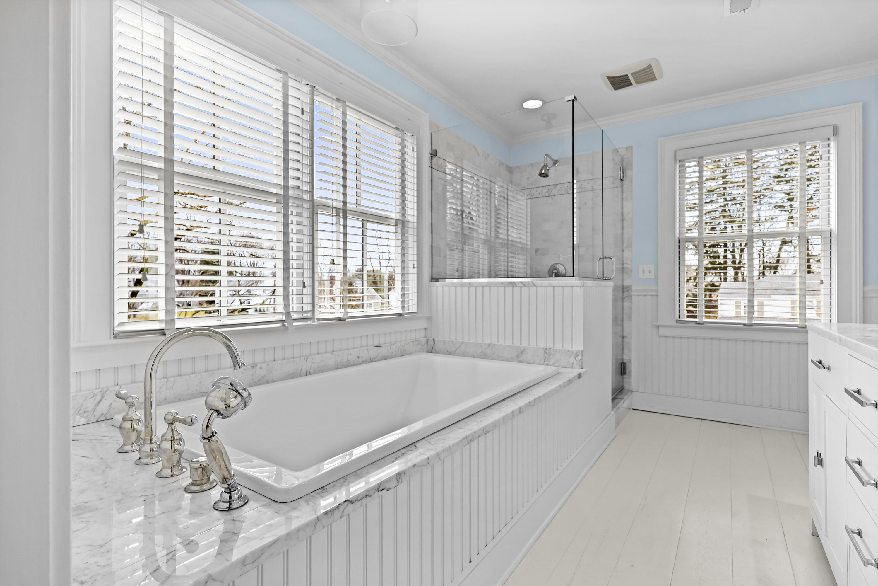 100 Hollow Tree Ridge Road Darien, CT 06820 - Photo 26 of 38 a bathroom with a tub a sink and a window