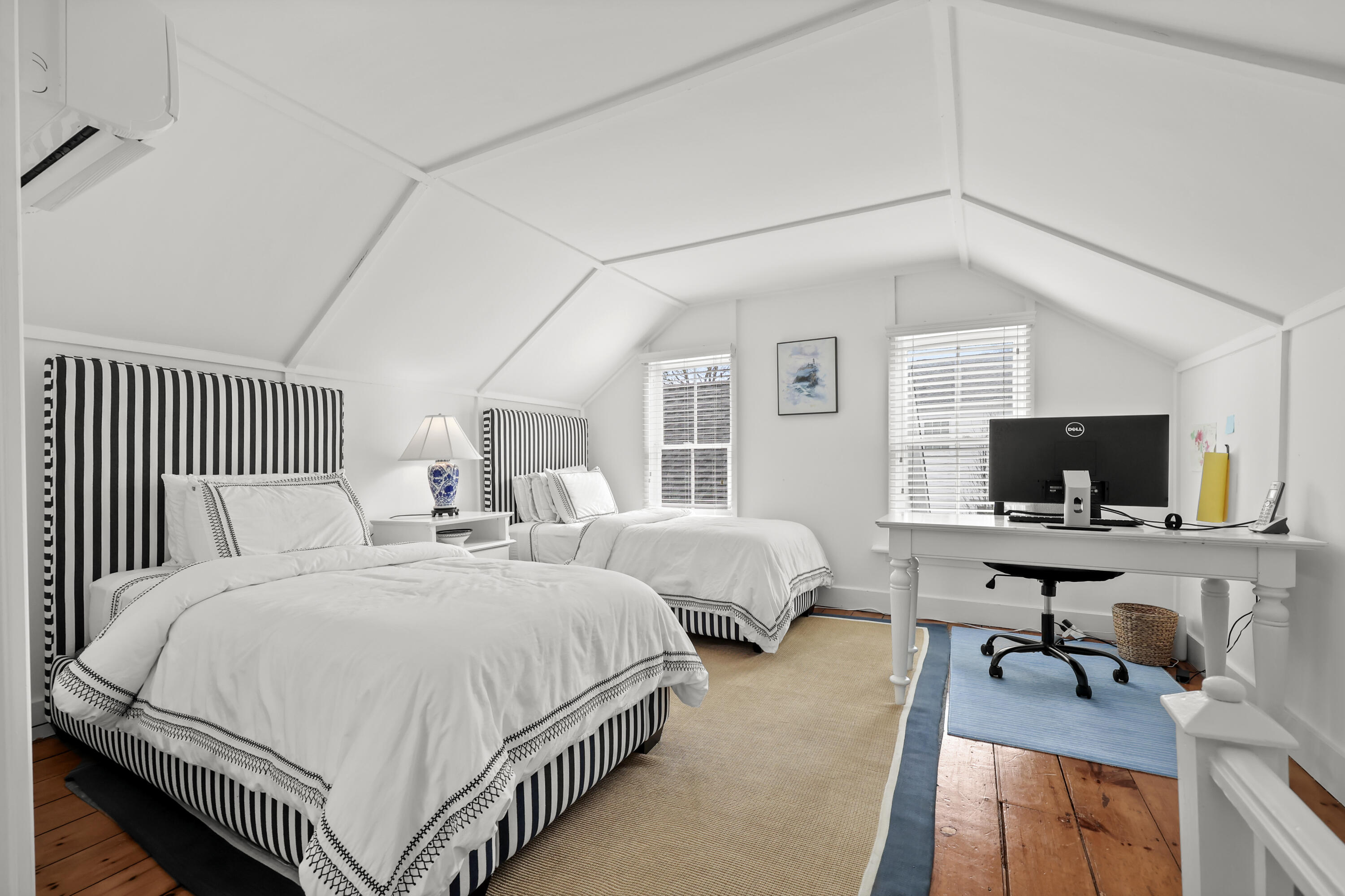 100 Hollow Tree Ridge Road Darien, CT 06820 - Photo 31 of 38 a bedroom with two beds and a flat screen tv